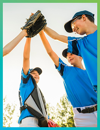 youth baseball team cheering