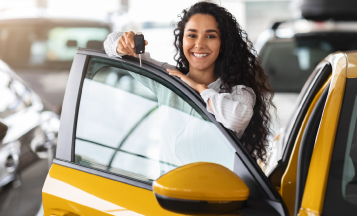 a woman shopping for a car