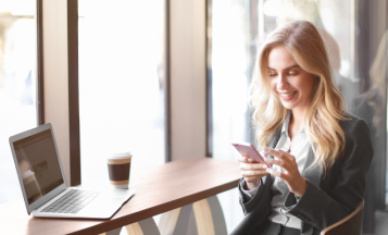 a woman holding a mobile phone